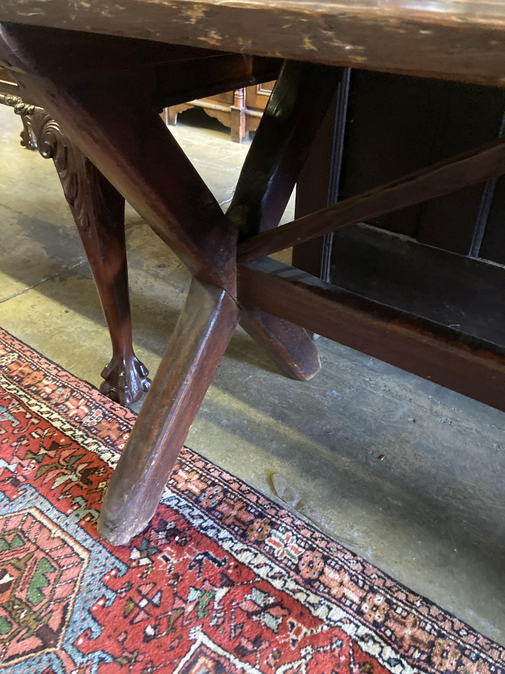 A 19th century pine refectory table, on trestle end supports, width 188cm, depth 68cm, height 77cm